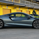 Side view of 2023 McLaren Artura in gray.